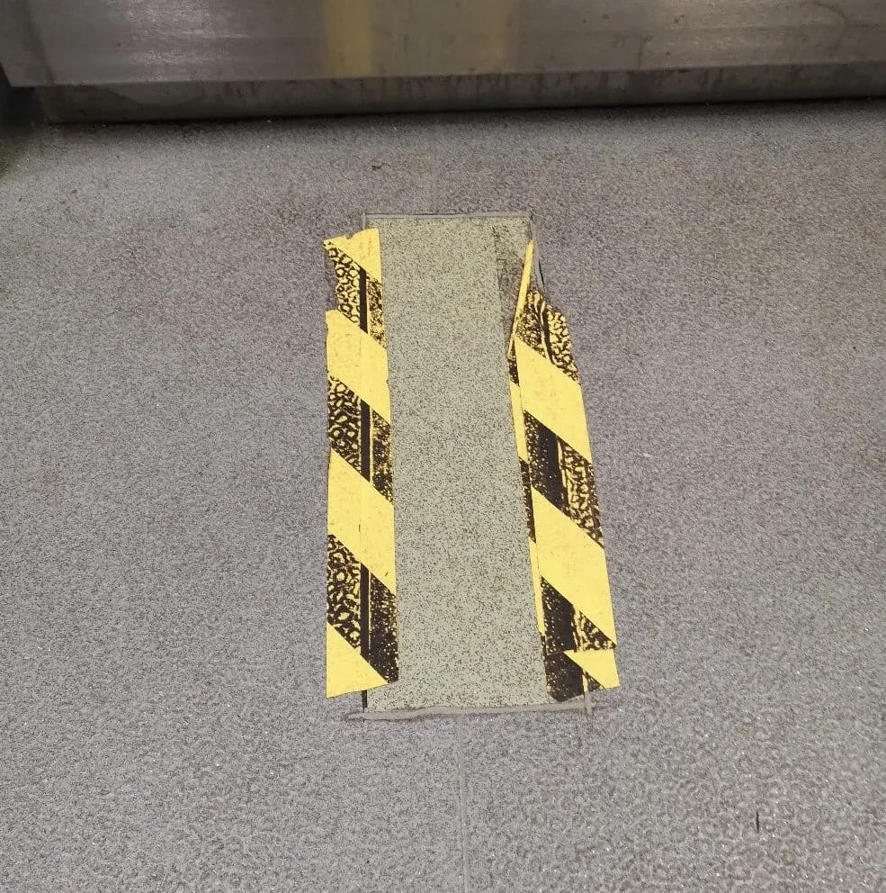 Lifted vinyl around drains, full replacement avoided.