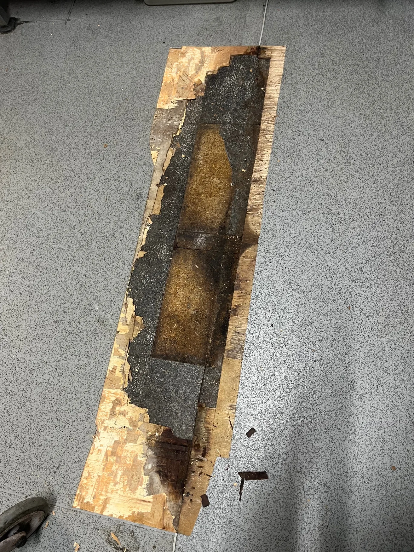 Before, commercial kitchen sub-floor and safety vinyl plank repair