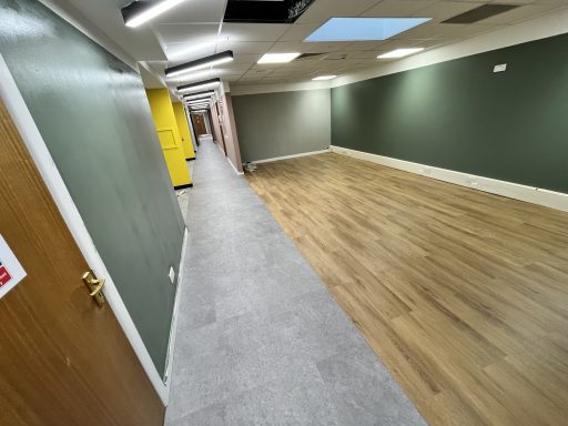 Healthcare & Commercial Flooring Installation Commercial LVT and safety flooring installation in a refurbished commercial interior.