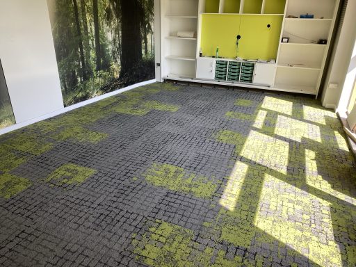 School Flooring Installation School carpet tile installation in a modern learning and classroom environment.