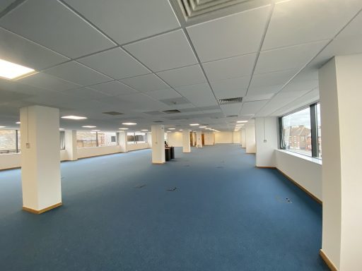 Commercial Office Carpet Tiles Commercial office carpet tile installation in a large open-plan office.