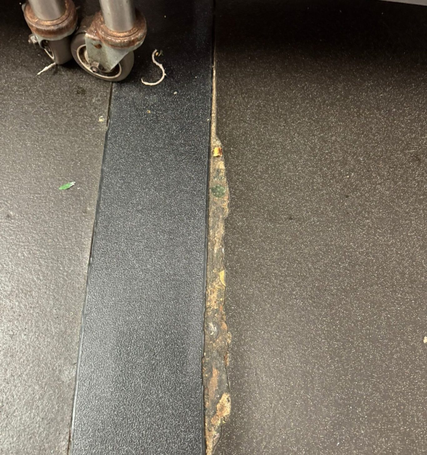 Commercial Vinyl Weld Repair Failed welded vinyl flooring joint causing hygiene and floor integrity concerns in a commercial kitchen environment.