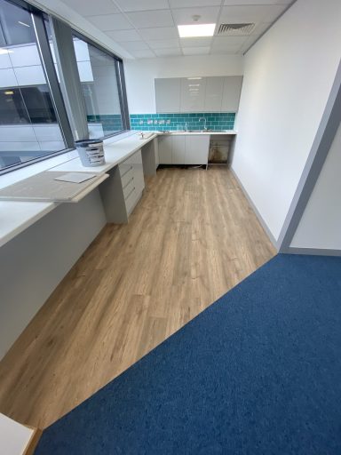 Commercial kitchen and staff breakout area flooring installation with LVT and carpet tiles. Commercial kitchen and staff breakout area flooring installation with LVT and carpet tiles.
