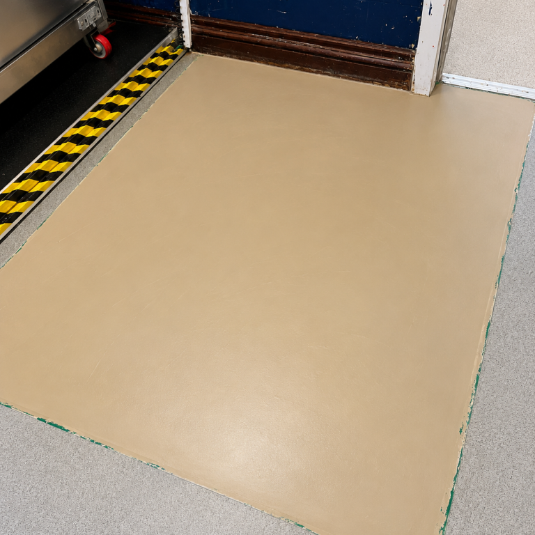 Commercial subfloor preparation and smoothing prior to new safety flooring installation.